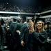 An Eastern Michigan University graduate smiles and applauds during the Spring Commencement on Sunday, April 28. Daniel Brenner I AnnArbor.com